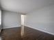 A spacious living room features hardwood floors and light gray walls with white trim at 2219 W 59Th St, Indianapolis, IN 46228