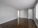 A spacious living room features hardwood floors and light gray walls with white trim at 2219 W 59Th St, Indianapolis, IN 46228