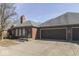 Charming brick home featuring a three-car garage and a well-manicured front yard and nice curb appeal at 223 Andrews Boulevard East Dr, Plainfield, IN 46168