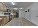Spacious kitchen features wood cabinets and black appliances, offering ample storage and functionality at 223 Andrews Boulevard East Dr, Plainfield, IN 46168