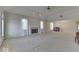 Spacious living room featuring a fireplace, neutral carpet, lots of windows, and ample natural light at 223 Andrews Boulevard East Dr, Plainfield, IN 46168