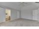 Comfortable main bedroom showcasing carpet, soft natural light, and access to the bathroom at 223 Andrews Boulevard East Dr, Plainfield, IN 46168