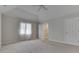 Bright main bedroom with vaulted ceilings, carpet, and a door leading to a bathroom at 223 Andrews Boulevard East Dr, Plainfield, IN 46168