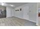 Mud room with laminate floors, decorative wallpaper, and convenient access to outside at 223 Andrews Boulevard East Dr, Plainfield, IN 46168