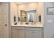 Bathroom with a double sink vanity, granite countertop, modern fixtures, and an attached shower at 28 Lively Pl, Cicero, IN 46034