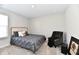 Cozy bedroom with a plush bed with decorative pillows, an accent chair, and framed art creating a relaxing atmosphere at 28 Lively Pl, Cicero, IN 46034