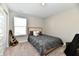 Cozy bedroom featuring a neutral color scheme and carpeted floors with a window providing natural light at 28 Lively Pl, Cicero, IN 46034
