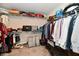 Walk-in closet offers ample storage with wire shelving and hanging space for clothes and accessories at 28 Lively Pl, Cicero, IN 46034
