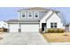 Charming two-story home with a three car garage, concrete driveway and manicured lawn at 28 Lively Pl, Cicero, IN 46034