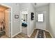 Inviting hallway featuring hardwood floors, leading to a bathroom with a shower and bedroom at 28 Lively Pl, Cicero, IN 46034