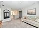 Spacious open concept living area with carpet, a comfortable couch, and lots of natural light at 28 Lively Pl, Cicero, IN 46034