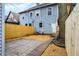 Backyard with new wooden fence, brick path, and grassy area at 342 N Arsenal Ave, Indianapolis, IN 46201
