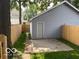 View of the backyard, with a small patio and a wooden fence at 342 N Arsenal Ave, Indianapolis, IN 46201
