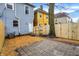 Backyard with new wooden fence, brick path, and grassy area at 342 N Arsenal Ave, Indianapolis, IN 46201
