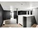 Unfinished basement features carpet flooring and black and white striped walls at 342 N Arsenal Ave, Indianapolis, IN 46201