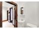 Cozy bathroom featuring a sink, toilet, and a mirror on the wall at 342 N Arsenal Ave, Indianapolis, IN 46201