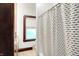 Bathroom featuring a vanity with granite countertops and a shower with modern shower curtain at 342 N Arsenal Ave, Indianapolis, IN 46201