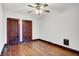 This bedroom features a ceiling fan and beautiful wood flooring at 342 N Arsenal Ave, Indianapolis, IN 46201