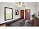 Cozy bedroom featuring a large bed, ceiling fan, and hardwood floors for a comfortable and stylish space at 342 N Arsenal Ave, Indianapolis, IN 46201