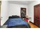 Comfortable bedroom with a closet for storage and warm hardwood floors at 342 N Arsenal Ave, Indianapolis, IN 46201