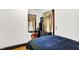 A bedroom with stylish curtains and an elegant vanity, and warm hardwood floors at 342 N Arsenal Ave, Indianapolis, IN 46201