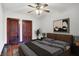 Bedroom with decorative doors, hardwood floors, and ceiling fan for added comfort and style at 342 N Arsenal Ave, Indianapolis, IN 46201