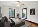 Bedroom with two windows, a ceiling fan, and hardwood floors, offering a bright and airy feel at 342 N Arsenal Ave, Indianapolis, IN 46201