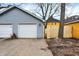 Detached garage, new wooden fence, brick path, and grassy area at 342 N Arsenal Ave, Indianapolis, IN 46201