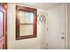 Hallway features a window with dark trim and a door with a coat rack at 342 N Arsenal Ave, Indianapolis, IN 46201