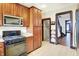 The kitchen features stainless appliances and ample cabinet space with granite countertops at 342 N Arsenal Ave, Indianapolis, IN 46201