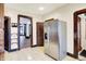 Open concept kitchen showcases stainless steel refrigerator with easy access to the living area at 342 N Arsenal Ave, Indianapolis, IN 46201