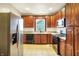 Bright kitchen features granite countertops, stainless steel appliances, and wood cabinetry at 342 N Arsenal Ave, Indianapolis, IN 46201