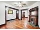 The bright living room features hardwood flooring, vintage fireplace and lots of charm at 342 N Arsenal Ave, Indianapolis, IN 46201