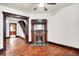 A bright living room features hardwood flooring and a decorative vintage-style fireplace at 342 N Arsenal Ave, Indianapolis, IN 46201