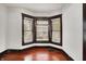 Charming living room featuring hardwood floors and a bright bay window with natural light at 342 N Arsenal Ave, Indianapolis, IN 46201