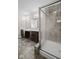 Bathroom with large shower, double vanity sinks and stylish lighting at 4236 Stubbington Ln, Indianapolis, IN 46239