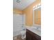 Well-lit bathroom featuring a shower-tub combo and a single sink vanity at 4236 Stubbington Ln, Indianapolis, IN 46239