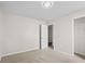 A light-filled bedroom features neutral carpet and paint, and closet at 4236 Stubbington Ln, Indianapolis, IN 46239