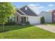 Charming home with a two-car garage, brick accents, and a well-maintained lawn and landscaping at 4236 Stubbington Ln, Indianapolis, IN 46239
