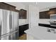 Kitchen features stainless steel appliances and dark wood cabinetry at 4236 Stubbington Ln, Indianapolis, IN 46239