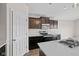 This kitchen features stainless steel appliances and dark wood cabinetry at 4236 Stubbington Ln, Indianapolis, IN 46239