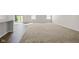 Empty living room with neutral carpeting, and a breakfast bar at 4236 Stubbington Ln, Indianapolis, IN 46239