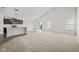 Spacious open-concept living room with vaulted ceilings and neutral color palette at 4236 Stubbington Ln, Indianapolis, IN 46239