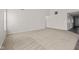 Spacious, empty living room with neutral carpeting and natural light at 4236 Stubbington Ln, Indianapolis, IN 46239