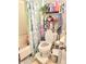 Bathroom features a shower with curtain, storage shelving, and convenient accessories at 5212 Bahia Dr, Indianapolis, IN 46237