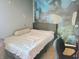 Bedroom featuring a bed, decorative wall art, and comfortable lighting at 5212 Bahia Dr, Indianapolis, IN 46237