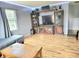 Living room with wood floors, large entertainment center, and comfortable seating at 5212 Bahia Dr, Indianapolis, IN 46237