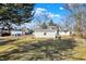 Large backyard with detached garages and mature trees, offering ample outdoor space at 529 W 42Nd St, Indianapolis, IN 46208