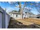 The home's backyard includes mature trees, fencing and an ornamental fire pit at 529 W 42Nd St, Indianapolis, IN 46208