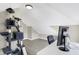 Cozy carpeted bedroom with sloped ceilings, neutral paint, desk, and ample floor space at 529 W 42Nd St, Indianapolis, IN 46208